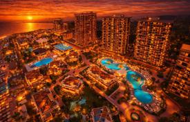Lüks bir tatil köyünde aydınlık iki odalı daire. $190,000
